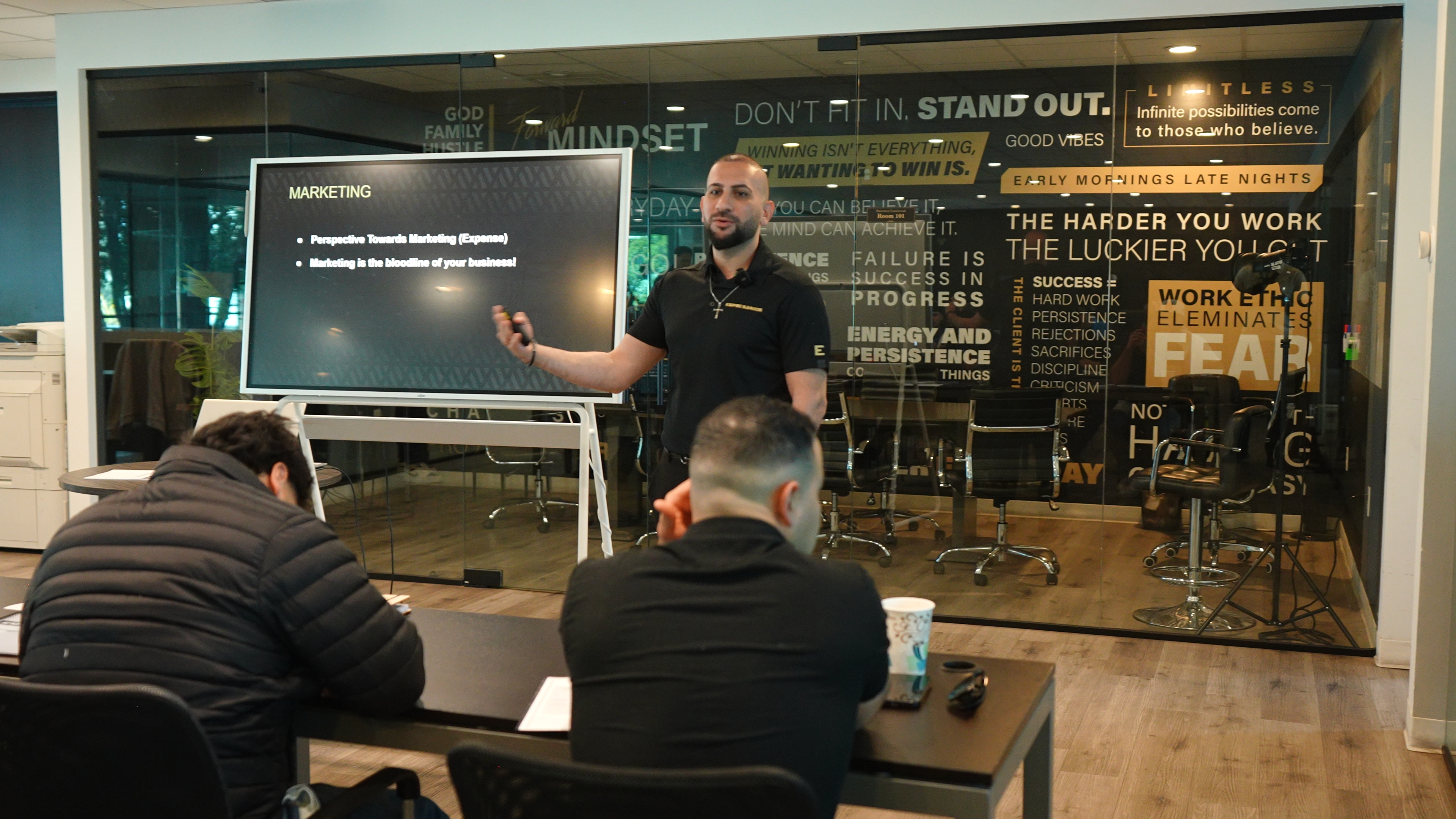 Sal Shakir walking through a full room of business owners at a live event